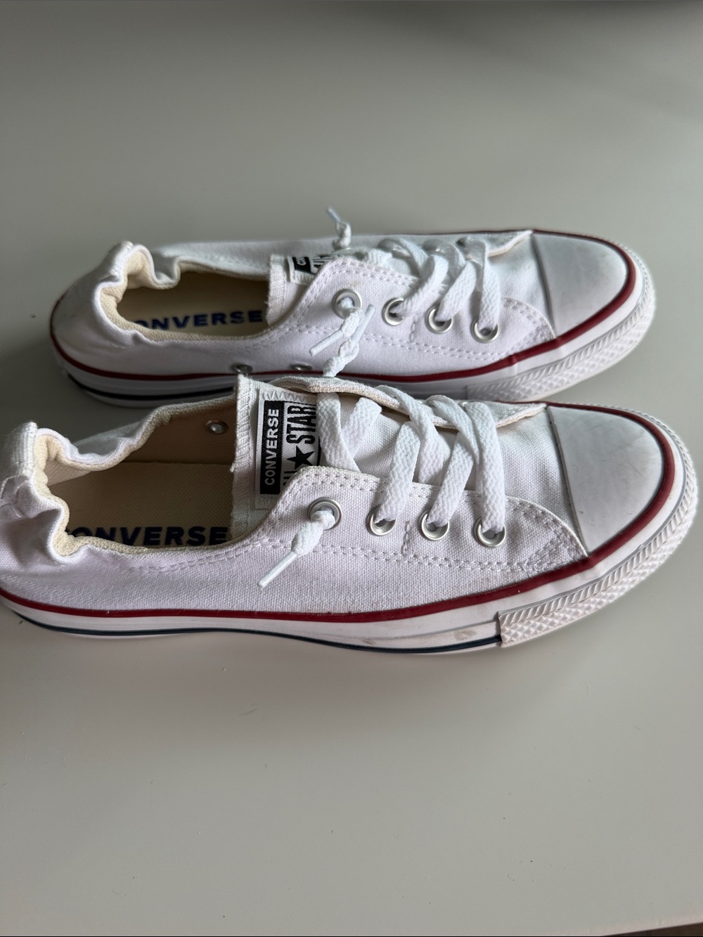 Converse White Low Top Sneakers with Red Trim